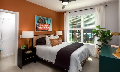 a bedroom with a bed and two nightstands